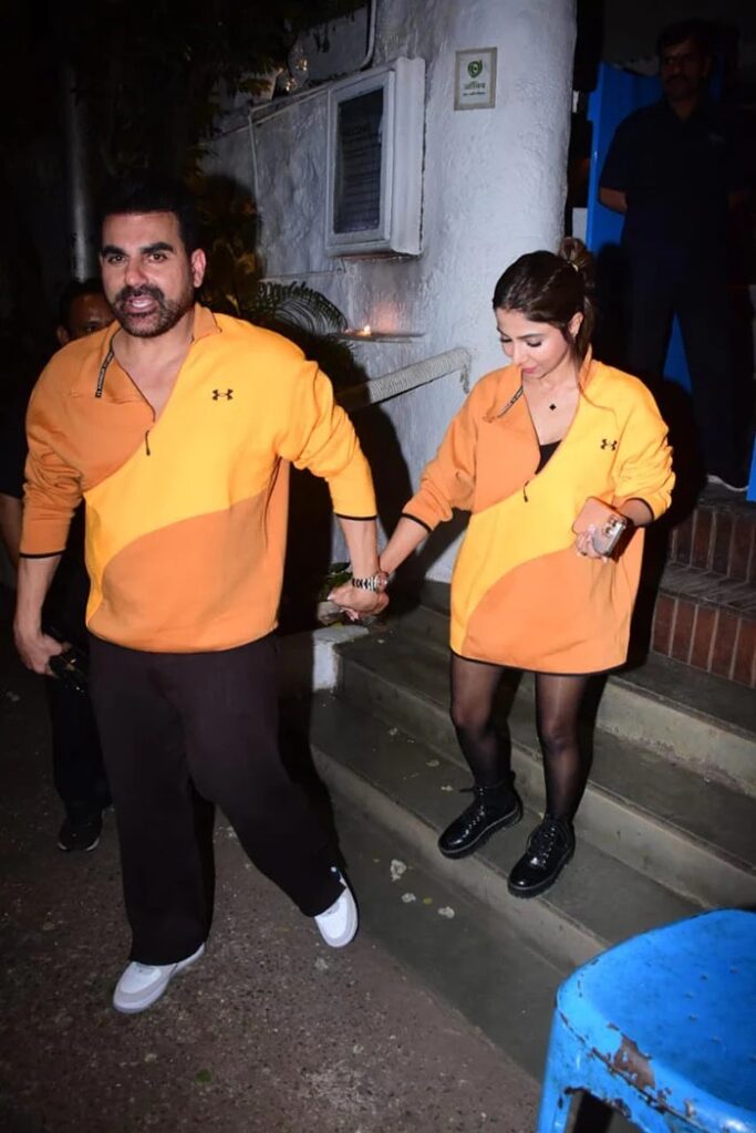"Arbaaz Khan and Wife Sshura Radiate Couple Vibes in Coordinated Orange Outfits"