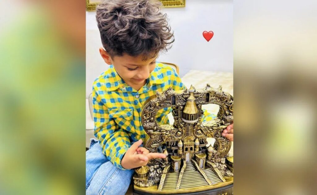 Munawar Faruqui Shares Heartwarming Moment: Son Mikael Poses with Bigg Boss 17 Trophy